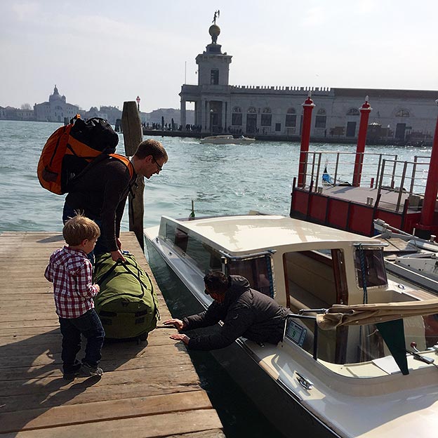 The Newcamp family boards a boat in Venice