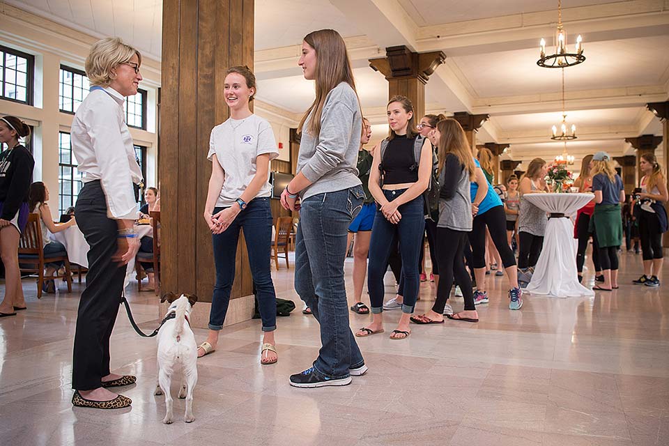Students wait in line for their turn to speak with President Cervelli at the'Tea with the President' event