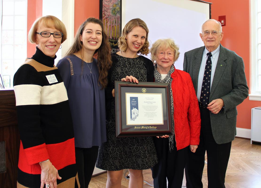 Beth Castle, class of 2000, is pictured in the center