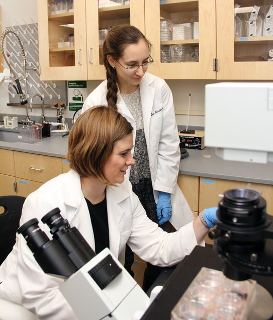 Professor Calli Davison Versagli '09 helps Darya Bondarenko '18 review some for the data she has collected