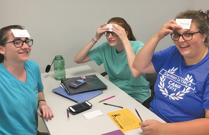 Students with Post-it notes on head