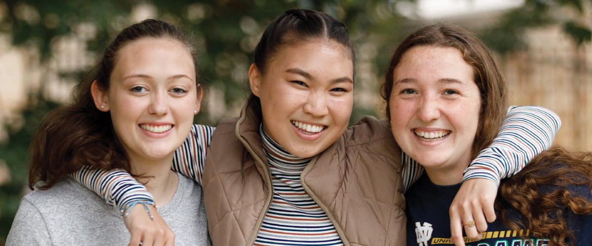 Three women smiling for picture