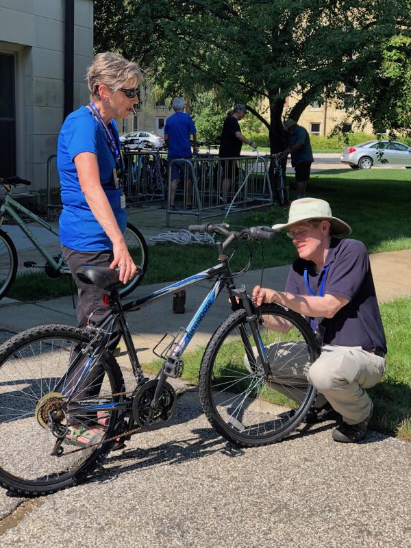 Pilgrims adjusting bike tire