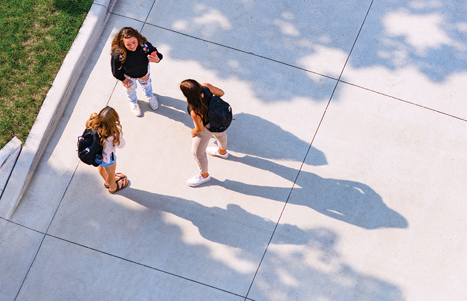 Three students talking