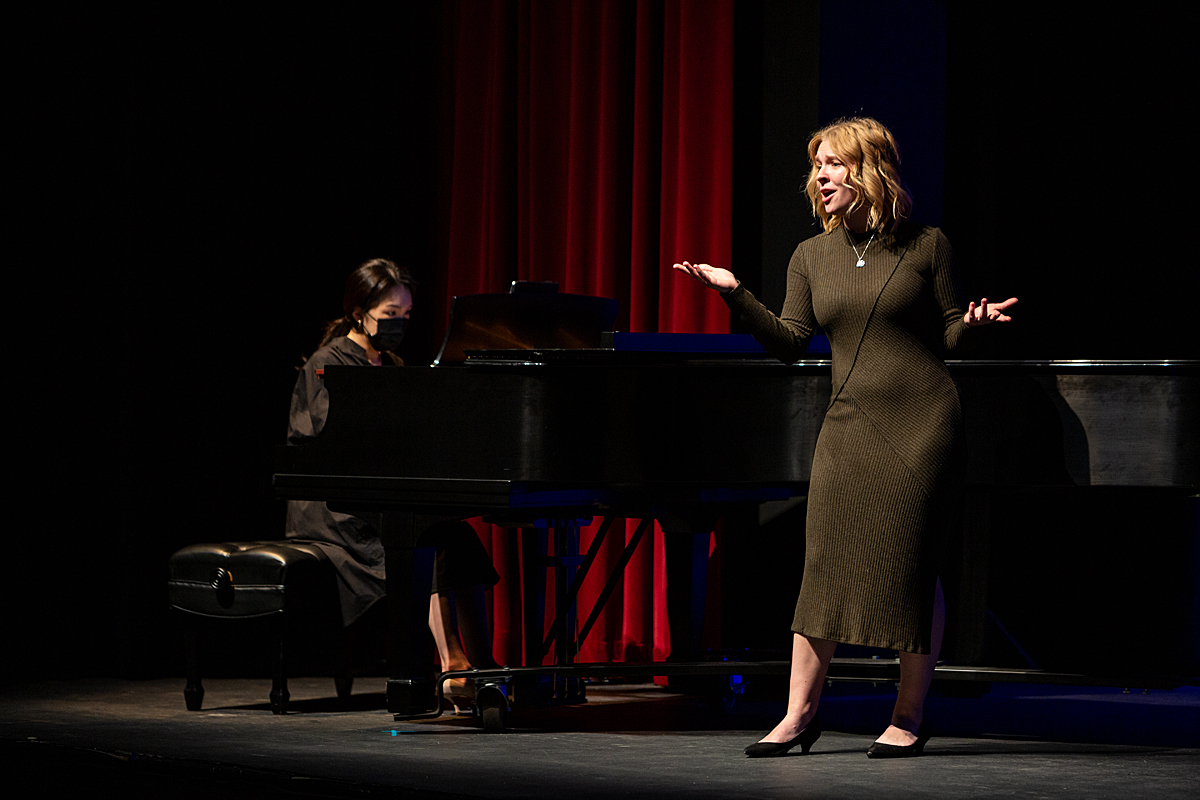 Singer and pianist perform on stage