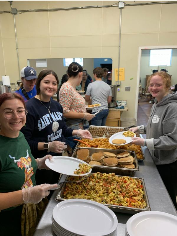 Saint Mary's students serve breakfast at Our Lady of the Road
