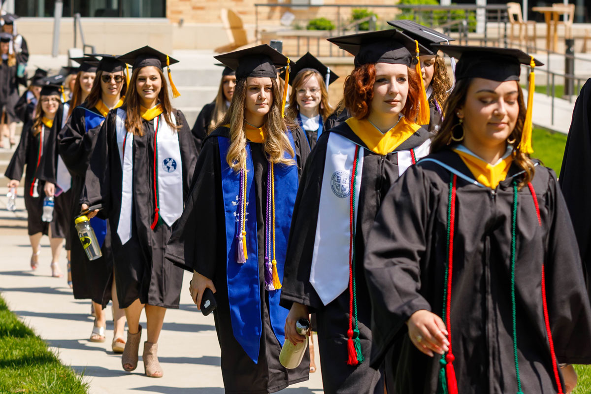 graduates walking in line