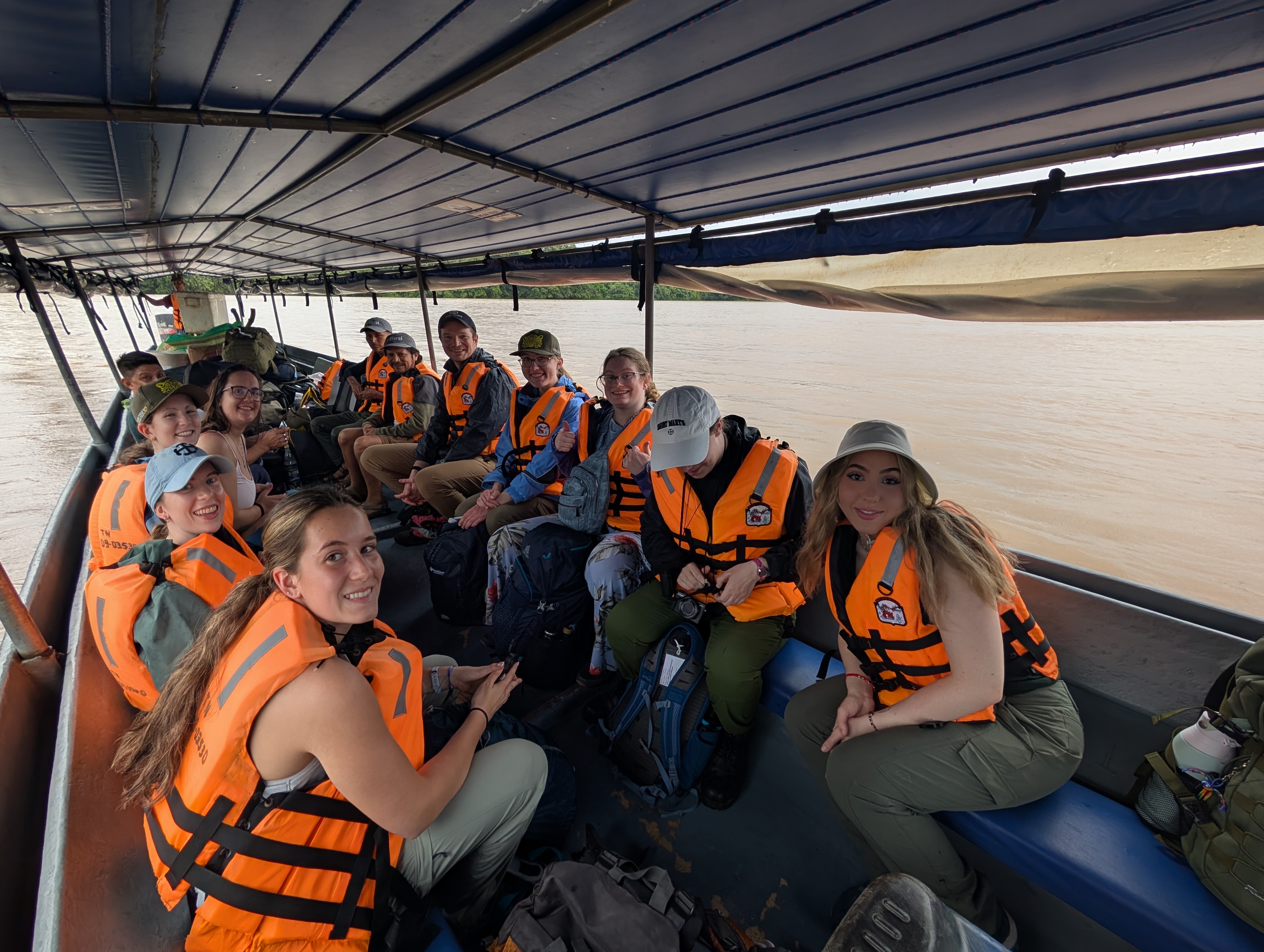 Decked out in their lifejackets, Saint Mary's students and their guides take a boat ride on the Tiputini River.