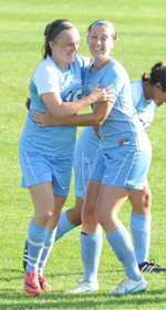 Rosie Biehl (left) and Kerry Green celebrate Biehl's goal.