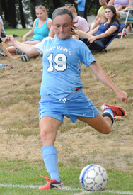 Rosie Biehl takes a corner kick against Bethel.