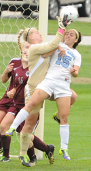 Alma's Julie Debus pulls the ball away from Erin Mishu early in the second half.