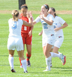 #3 Lindsay Rzepecki and #2 Kerry Green celebrate Green's go-ahead goal.