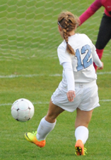 Rachel Schulte (12) sends her shot in for the fifth goal of the game.