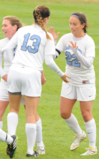 Mollie Valencia (22) celebrates her goal with Emily Rompola (13).