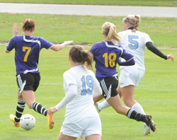 Maggie Wenzel (5) sends her game-winning shot to goal.