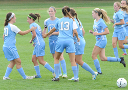 The Belles celebrate Kelly Wilson's (second from left) goal.