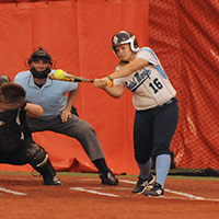 Caitlyn Migawa drives in the first run of the day for the Belles.