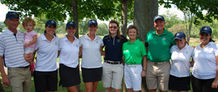 Members of the golf team take a photo with tournament beneficiaries Katie '08, Diane, and Tim O'Brien.