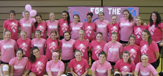 Both teams pose for a photo before Wednesday's Dig for the Cure match.