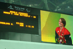 amanda's image on a big electronic billboard at the paralympic games