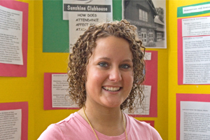 Stroude in front of her research display