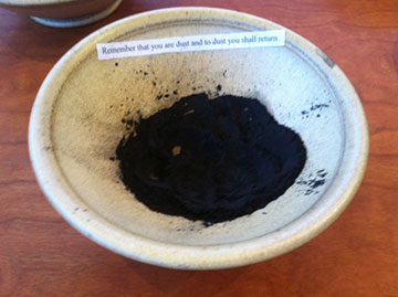 Ashes distributed at an Ash Wednesday liturgy in Regina Chapel today.