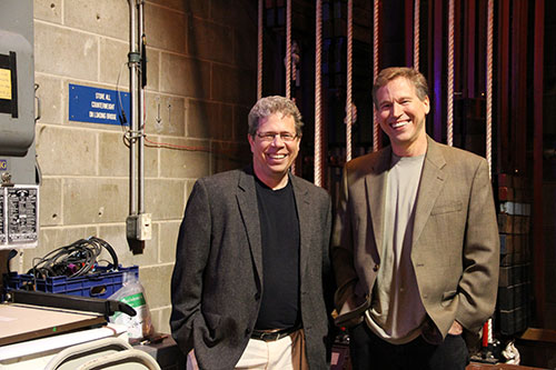 Saint Mary's College professors Mark Abram-Copenhaver and Bill Svelmoe pose backstage at O'Laughlin Auditorium on campus. 