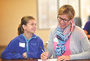 Fifth grader Mazie Markes, left, and her mom,  Heidi Markes, attended the 2014 "Bloom for Girls"  seminar at Saint Mary's College.