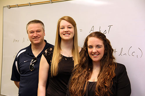 Steven Broad, assistant professor of mathematics, is pictured with students Olivia McIntee '13 and Samantha Brady '13.