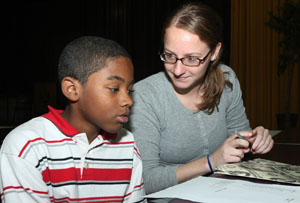 CAT volunteer tutoring student