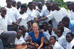 Caitlin Brodmerkel with school children of Uganda