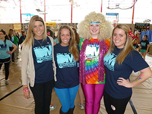 "Rock of Ages" was the theme of this year's event. From left to right are Stephanie Gehring '13, Meghan Cronin '13, Brigid Hurley '13, and Emily Veihmeyer '13.