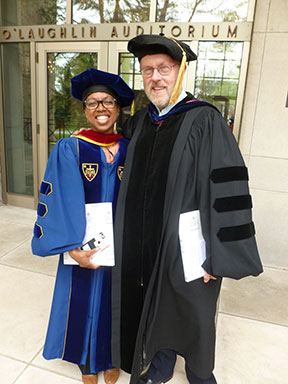 Professors Stacy Davis and Marc Belanger pose for a photo following Honors Convocation. Davis was honored with the Maria Pieta Award and Belanger received the Spes Unica Award that afternoon.