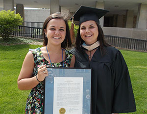Kelly Gutrich '15, the 2013 recipient of the Saint Catherine's Medal, poses with Kathryn Gutrich '13 following Honors Convocation.