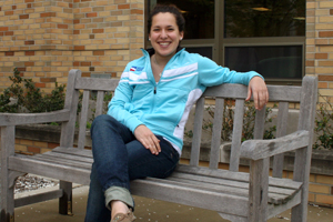 hoffman sitting on a bench on campus