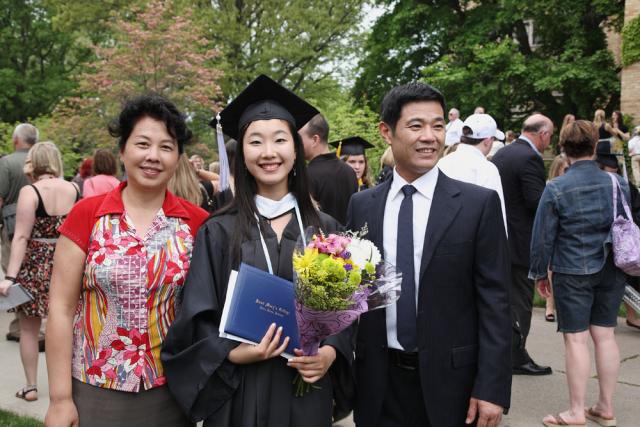 Jingqui Guan '11 poses with her parents, who came all the way from Chengdu, China to attend Commencement.