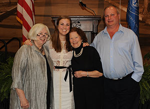 Kaitlyn Rabach '15, center left, poses with her late mother's godmother, Tina Duignan, and her father,  Tim Rabach. To Kailtlyn's left is Saint Mary's College  President Carol Ann Mooney.