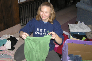 Kristin Hingstrum prepares clothes for St. Margaret's House