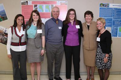 Ashley Cook '11, Chelsea Crane '11, Professor Tom Fogle, Emma Hoffman '11, Mary Burke '85, and Megan Weinandy '11 pose together at the "Celebrating the Education of Women in Science" event at the College on March 26, 2011.