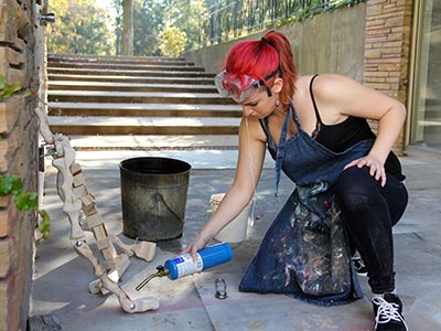 Mary Bevilacqua uses a torch on one of her art projects.