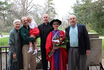 Phyllis Kaminski, center, poses with her brothers, the Rev. Frank Kaminski, S.J., and Paul F. Kaminski, far right. On the left is Paul's wife, Barbara, as well as Mia Kaminski and her dad (Phyllis' nephew) David Kaminski.