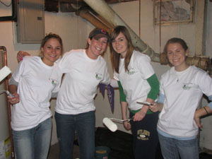 Saint Mary's students participate in Rebuilding Together by painting the interior of a home.