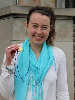 Sara Lipinski '15 displays the Saint Catherine Medal she received as a surprise at Honors Convocation on Sunday, May 4.