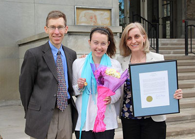 Sarah Lipinski '15, the 2014 recipient of the Saint Catherine Medal, poses with her parents outside O'Laughlin Auditorium following Honors Convocation. Not only was Sarah surprised by the recognition, she was surprised that her parents were there.