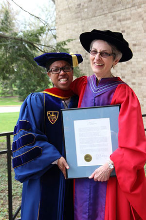 Professor Phyllis Kaminski, right, poses with Stacy Davis, associate professor of religious studies, who was among those who nominated her for the Maria Pieta Award.