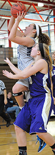 Krista Knapke drives to the hoop in the second half against Albion.
