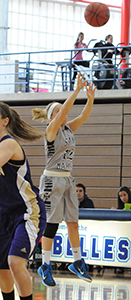 Maddie Kohler puts up a three-pointer in the first half against Albion.