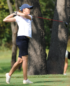 Justine Bresnahan watches her drive on the sixth hole.