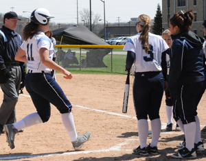 Jillian Busfield scores on her first of two home runs in the game one win.