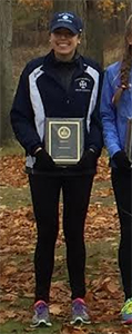 Brittany Beeler with her All-MIAA First Team plaque.